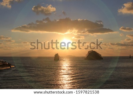 This is a picture of the sun setting through a small island on the beach.
And this is Anmyeondo, a famous beach in South Korea.