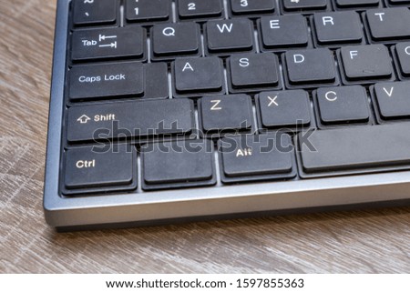 Close up of black keyboard on office desk.
