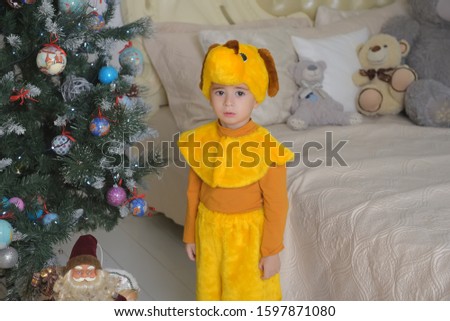 little boy in dog costume at christmas