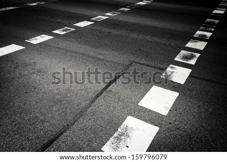 Close up of pedestrian crossing on asphalt