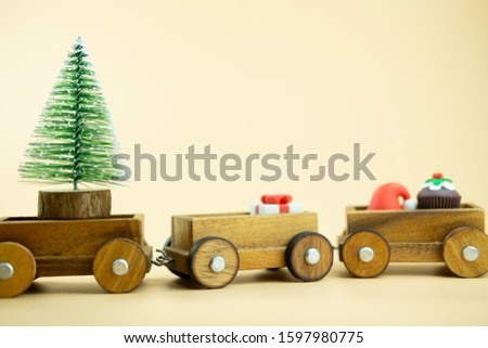 Wooden toy train and ornament for decoration Christmas tree. Merry Christmas and Happy New Year