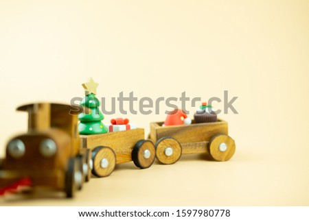 Wooden toy train and ornament for decoration Christmas tree. Merry Christmas and Happy New Year