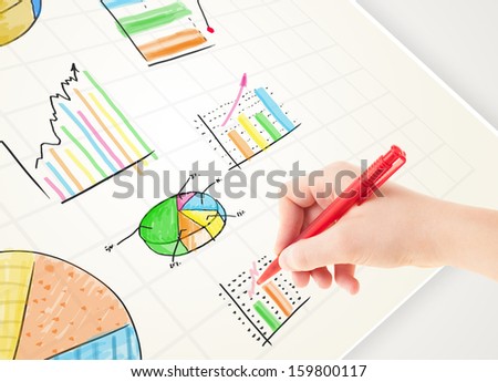 Business person drawing colorful graphs and icons on plain paper