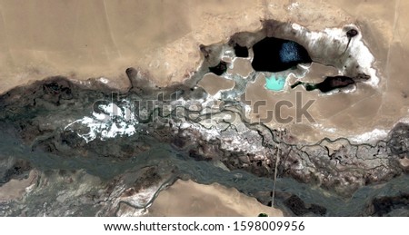 world dog, black gold, polluted desert sand, abstract photo of the deserts of Africa from the air. aerial view, Genre: Abstract Naturalism, from the abstract to the figurative