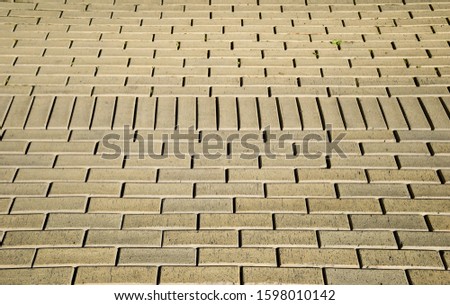 Texture of yellow paving slabs