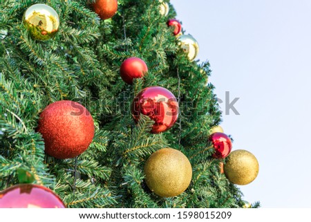 Christmas tree decorations for the New Year and Christmas in the form of a balls hang on the Christmas tree in Jerusalem, Israel