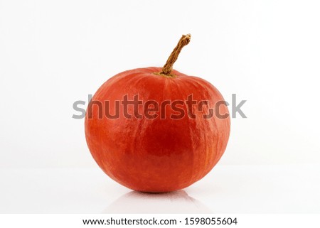 Red pumpkin on a white background, isolated