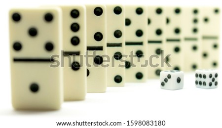 White domino and two dice close-up on a white isolated background. Board game
