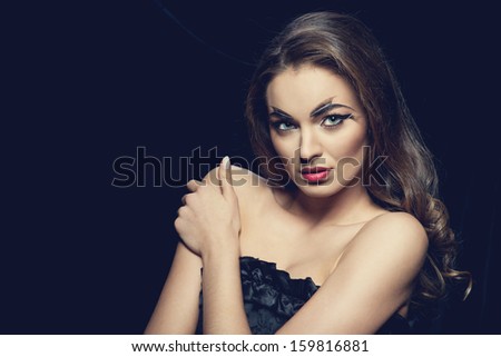 Fashion brunette model portrait with creative make-up red lips 