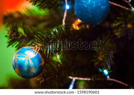 2020. Merry Christmas and New Year holidays  concept lovely decorated  glitter ball close up toys on the background. Selective focus