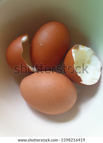 Photos of boiled eggs in a white cup