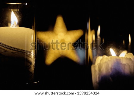Christmas decoration between two burning candle lights in Bergen, Norway 