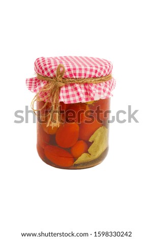 Canned vegetables. Red tomatoes in brine in the bank, isolated on white