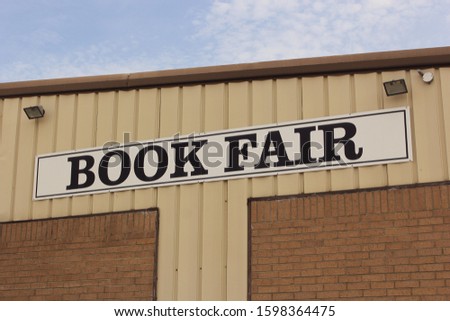 Book Fair Sign on Metal Building