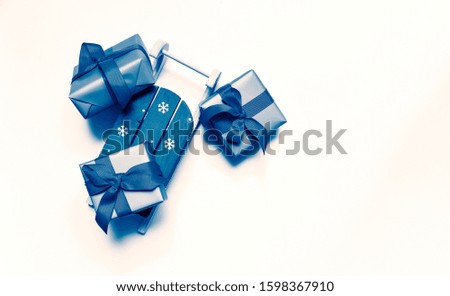 New Year Christmas Xmas holiday celebration present gift box fir tree branch copy space isolated white background minimal style. Color of the year 2020 classic blue toned