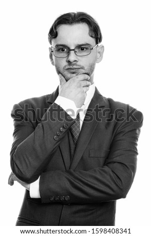 Close up of young businessman thinking and looking down
