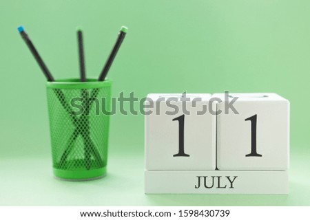 Desk calendar of two cubes for July 11