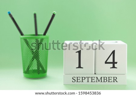 Desk calendar of two cubes for September 14