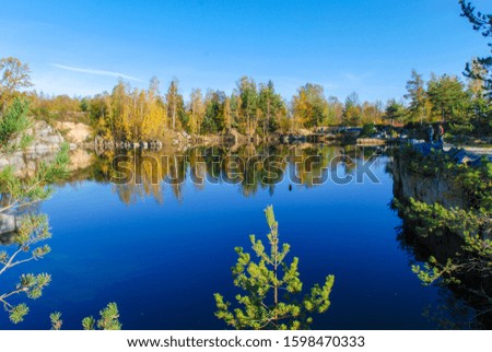 Autumn nature reflected in Borena Hora flooded quarry, Czech Republic 