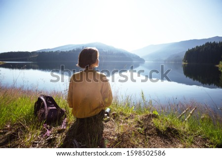 Summer - girl on a picnic by the lake.  Lacul Vidra,  Romania
