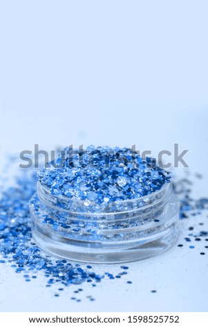 Blue shimmer and glitter in small plastic box