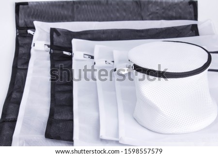  laundry bags white and black Royalty-Free Stock Photo #1598557579