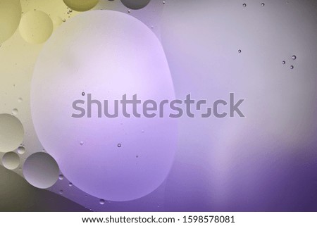 purple and green color abstract background from mixed water and oil