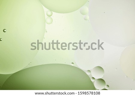 Beautiful light green color abstract background from mixed water and oil