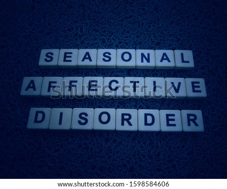 Seasonal Affective Disorder, word cube with background. Royalty-Free Stock Photo #1598584606