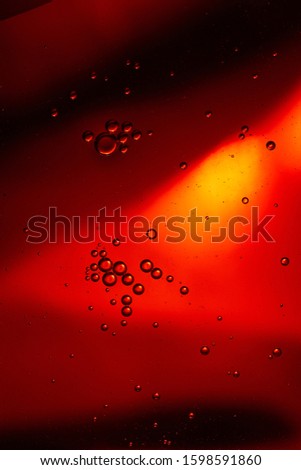 abstract red color background from mixed water and oil bubbles