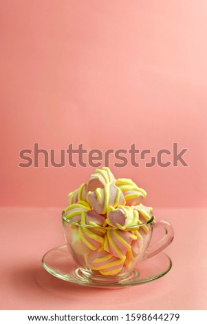 
sweet marshmallows on a pink background, the concept of the holiday and congratulations, birthday and children's holiday. place for text