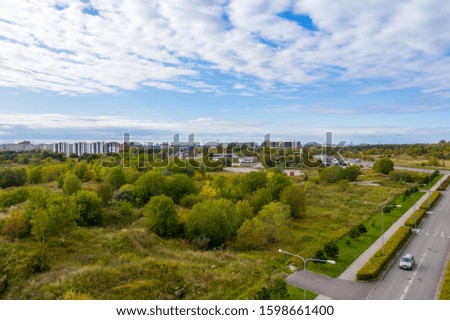 Green forest in the city of European country aerial view