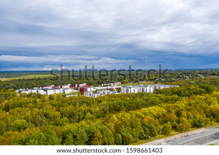 Green forest in the city of European country aerial view