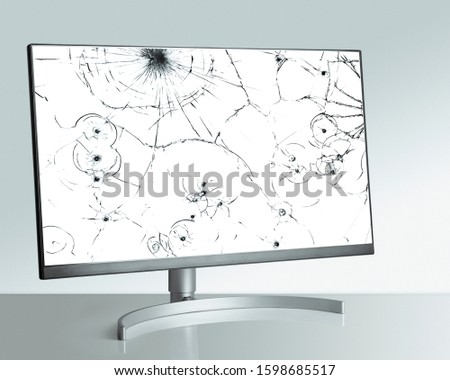 Broken modern monitor on light background. close up
