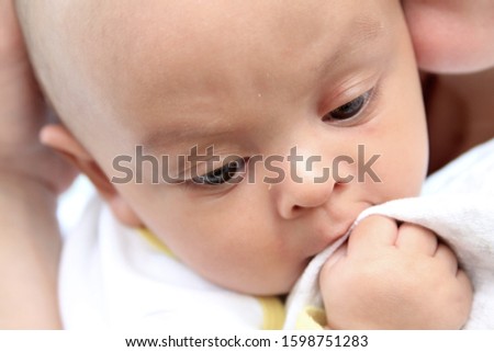 baby with his mother been cared for after having a good sleep in bed at home on white background stock photo