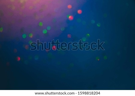 Blurred holographic psychedelic defocused lights blue background.