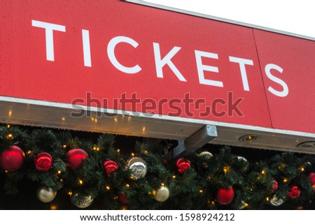 Close-up of a Tickets sign.