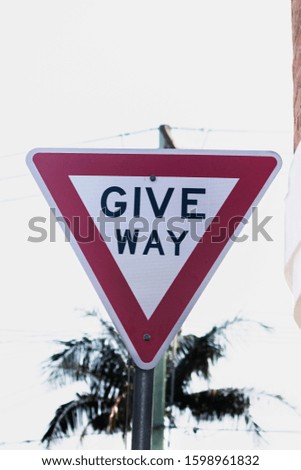 Give way. Signpost give preference.