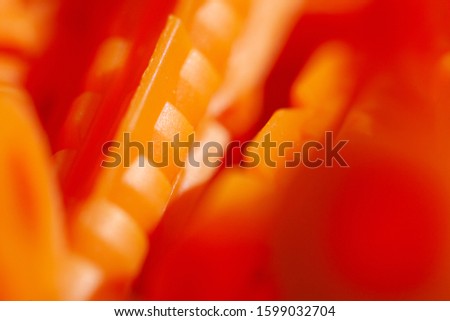 Orange dowels lie on a blue background macro shooting background picture