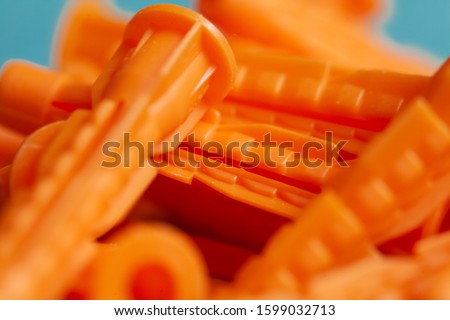 Orange dowels lie on a blue background macro shooting background picture