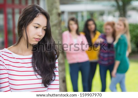 Female student being bullied by other group of students Royalty-Free Stock Photo #159907970