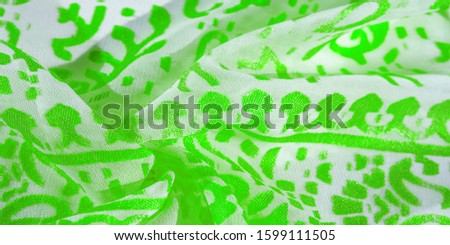 Texture, pattern, collection, silk fabric, female scarf, green emerald pastel on a beige background