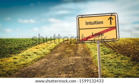 Street Sign the Direction Way to Intuition versus Logic Royalty-Free Stock Photo #1599132433