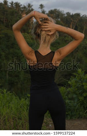 girl in tracksuit in the park at sunset
