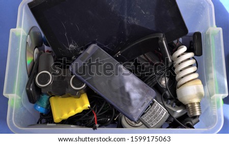 E-waste. Rapid technology change, planned obsolescence have resulted in surplus, which contributes to the increasing amount of hazardous electronic waste around the globe Royalty-Free Stock Photo #1599175063