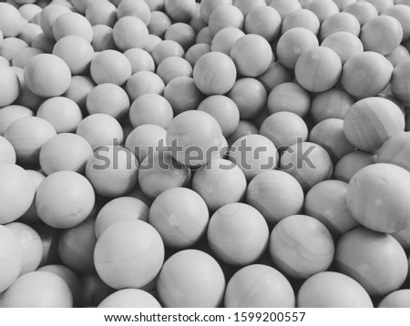 The wooden ball in the ball pit, natural toys for children, the wooden ball made from rubber tree, black and white picture