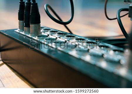 Audio snake and stage box with xlr cables and jacks at a live event