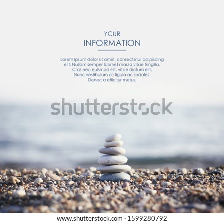 Zen pyramid of spa stones on the blurred sea background. Sand on a beach. Sea shores. Web article template. Long header banner format. Sale coupon. Visit card. Your information. Text space.
