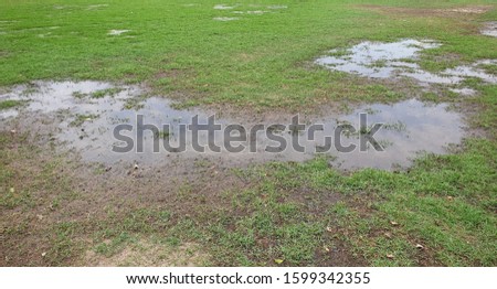 flooded soccer field after heavy rain.

 Royalty-Free Stock Photo #1599342355