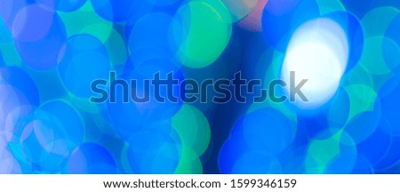 Abstract Bokeh Blue and green background of defocused glittering lights. Christmas, Party, New Year background pattern concept. banner